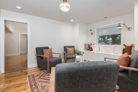 Relax in your sitting room off of the living room and primary suite