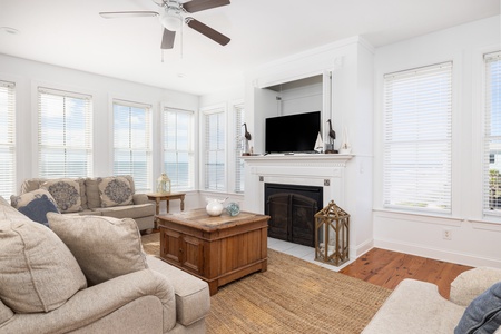 Unwind in your elegant living room with a cozy fireplace, perfect for relaxing evenings together
