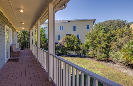 Relax on your large covered porch overlooking the backyard
