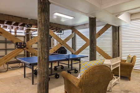 The garage space has a ping pong table for added entertainment