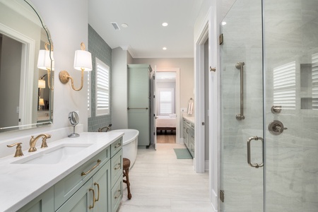 A spacious master bathroom where you can relax after a long day in the sun.