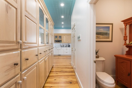 Take the hallway from the kitchen to your half bath