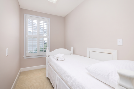 Sink into crisp, inviting linens in your peaceful bedroom retreat, where soft tones and natural light create the perfect space for restful nights.