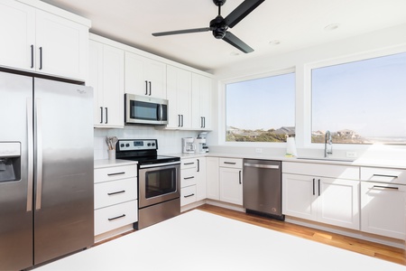 Your kitchen is equipped with stainless steel appliances and everything you need to make your favorite meals