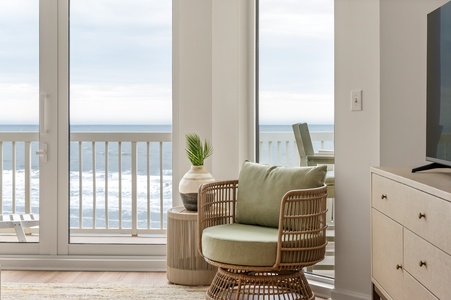 Wake to stunning ocean views from your private oceanfront retreat, where soft morning light fills your cozy seating area.