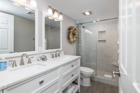 Your second king bedroom features an en suite bathroom with a large walk-in shower