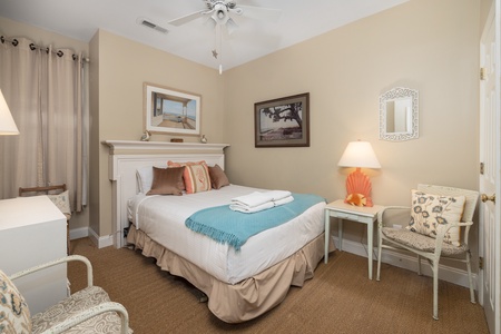Slip into the sheets in your second bedroom featuring a full bed