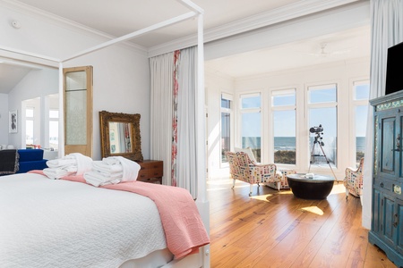 Your primary king bedroom features a calm sitting room overlooking the ocean