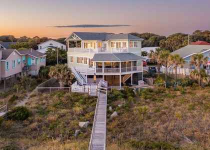 Oceanfront Luxury at Sea Salt – Stunning aerial view of your Folly Beach vacation home at sunset.