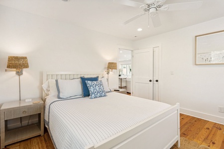Your second bedroom is streetside and features a cozy queen bed