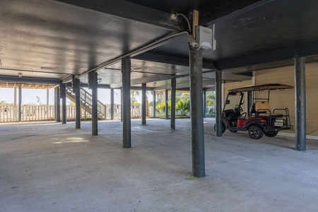 Your covered parking garage provides plenty of space for vehicles and includes a golf cart for putting around the island