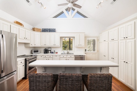 Your large kitchen features vaulted ceilings and plenty of natural light
