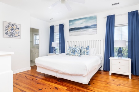 Your upstairs primary king bedroom features two en suite bathrooms