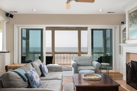 Relax in your coastal living room with large sliding doors leading to your deck
