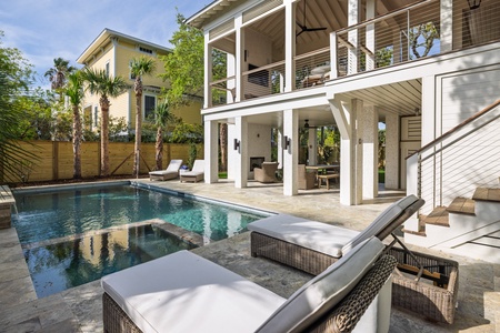 A private swimming pool and lounge chairs waits just out back