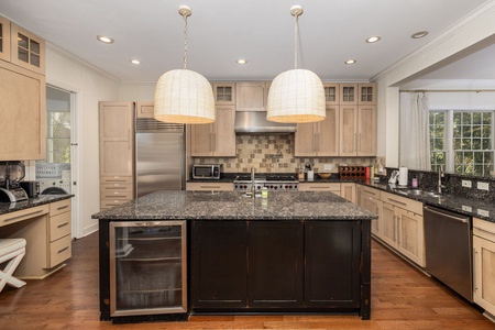 Your gourmet kitchen awaits with granite counters, stainless appliances, and a spacious island.