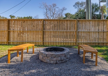 Gather around your private stone fire pit with curved teak benches, perfect for evening conversations under the stars.