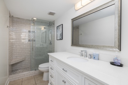 Enjoy a glass walk-in shower and large vanity in your king en suite bathroom