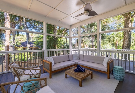 Unwind in your private screened-in back porch, where tropical breezes flow through floor-to-ceiling windows.
