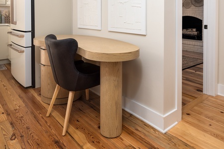 A dedicated work space sits just off the kitchen