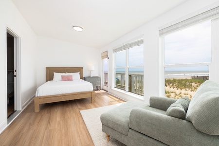 The sunroom offers a queen bed and access to the wrap-around deck