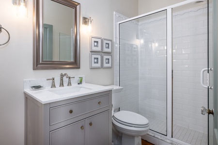 Your twin en suite bathroom has a walk-in shower and single vanity