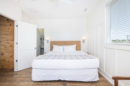 Your upstairs king bedroom features an en suite bathroom and private balcony