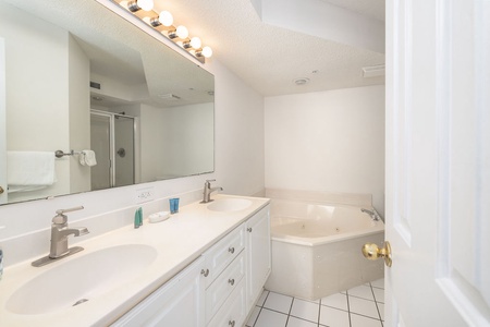 Unwind in your ensuite bathroom, with dual sinks and a relaxing jetted tub for ultimate comfort.