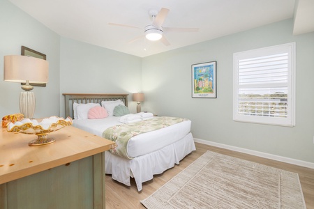 Drift into restful sleep in your serene bedroom with soft mint walls, plush bedding, and gentle ceiling fan creating the perfect peaceful retreat.