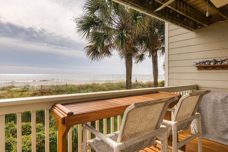 Relax on your private deck while enjoying stunning ocean views and swaying palm trees.