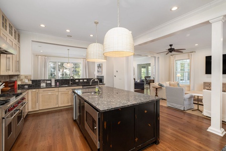 Your gourmet kitchen awaits with granite counters, stainless appliances, and a spacious island.