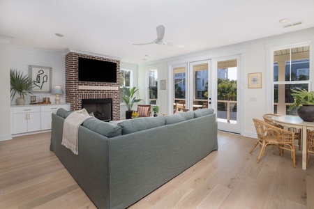 Relax in your bright living space with a cozy fireplace and open layout leading to your private patio.