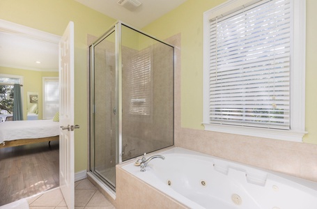 Your primary downstairs bathroom is equipped with a walk-in shower and soaking tub