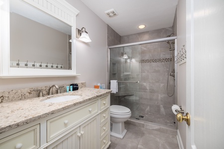 Refresh in your private bathroom with modern fixtures, a spacious walk-in shower, and elegant granite countertops. Soft lighting and neutral tones create a spa-like retreat after your adventures.
