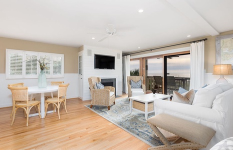 Sink into plush seating while ocean breezes drift through your sliding doors. Your bright, airy retreat features relaxing coastal charm.