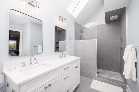 Primary ensuite with double vanity and large.