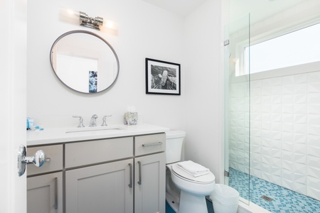 The primary king en suite has a beautiful walk-in shower