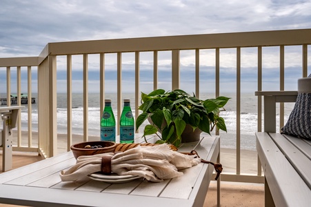Savor refreshing drinks on your private balcony while ocean waves create the perfect soundtrack for your coastal retreat.
