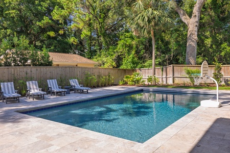Lounge in the chairs or take the plunge in your crystal-clear swimming pool