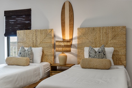 Drift off in your twin beds with stunning woven headboards and soft tropical touches that bring island serenity indoors.