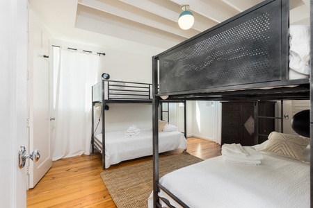 The downstairs bunk room is a perfect place for the kids and features its own en suite bathroom