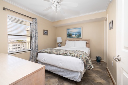 Your queen bedroom is tucked away and peaceful