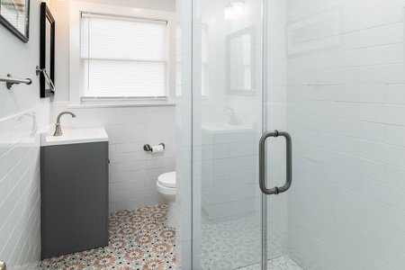 Your upstairs offers a full hallway bathroom with beautiful walk-in shower