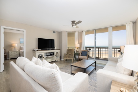 Relax in your large living room with sliding glass doors to your balcony