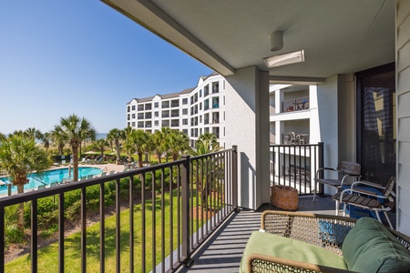 Your private balcony overlooks the on site pool and beach access