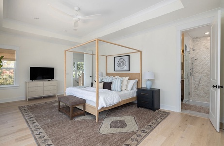 Your elegant master suite features a stunning canopy bed, cozy seating area, and spa-like ensuite for ultimate relaxation.