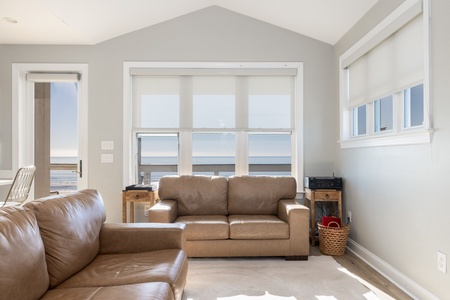 Natural light streams through the large windows of your living room
