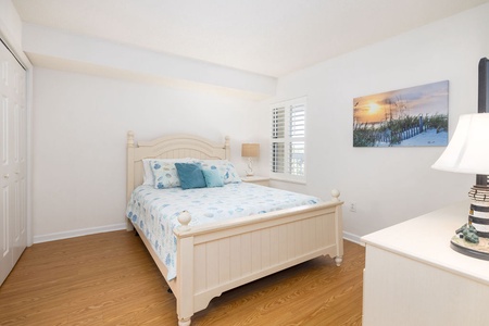 Rest peacefully in your coastal-themed queen bedroom with charming seaside tranquility.