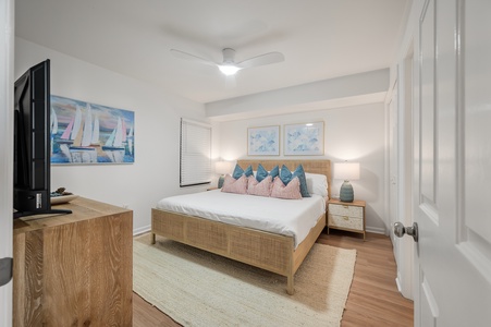 Drift off to sleep in your serene coastal bedroom, where nautical artwork and soft linens create the perfect retreat.