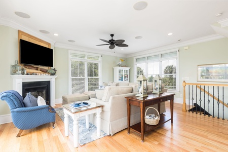 Relax in style with plush seating, large windows, and sliding doors leading to the ocean-view deck.